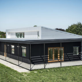 Upcycle House: Two Prefabricated Shipping Containers, Recycled Soda Cans