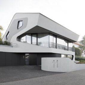 Reinforced Concrete House With Aluminum Facade