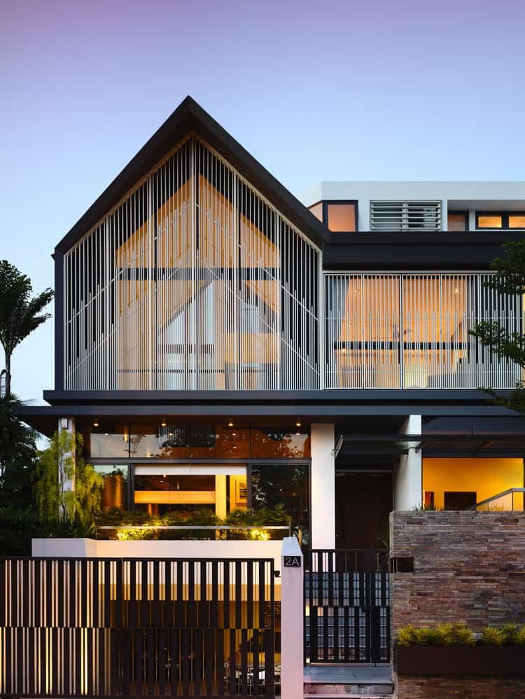 slatted facade house with sleek adjoined apartment 8 left side evening