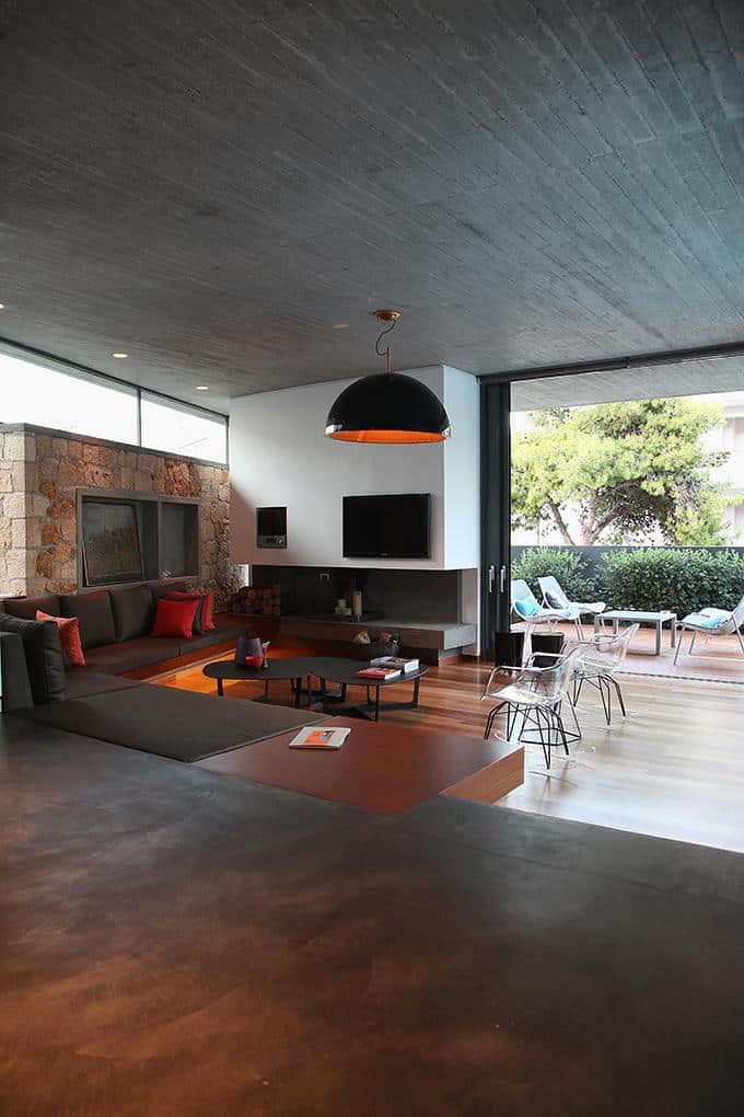 sleek-athens-house-blends-stone-with-concrete-textures-16-living-room-far.jpg