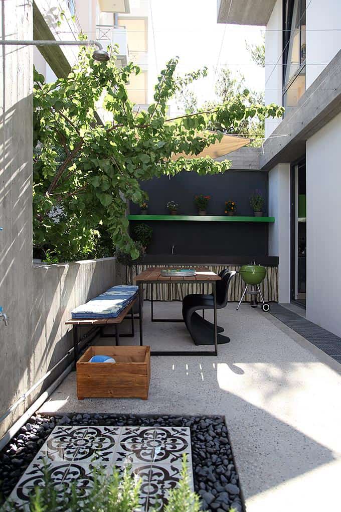 sleek athens house blends stone with concrete textures 8 courtyard