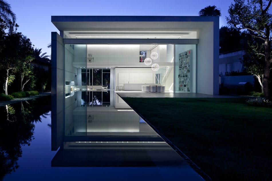 sleek cubic house with front and back gardens 17