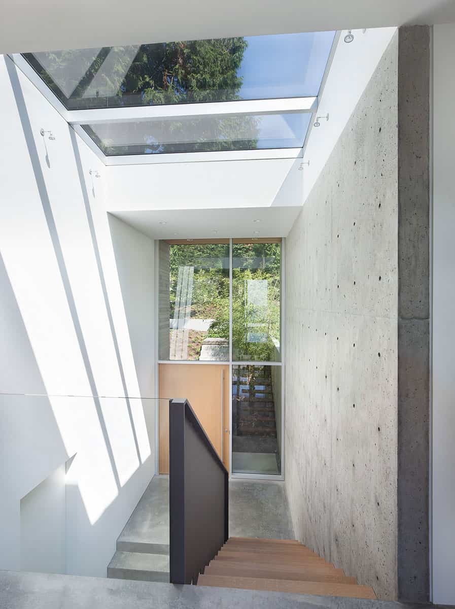 sleek slope house with interior featuring concrete 14 landing
