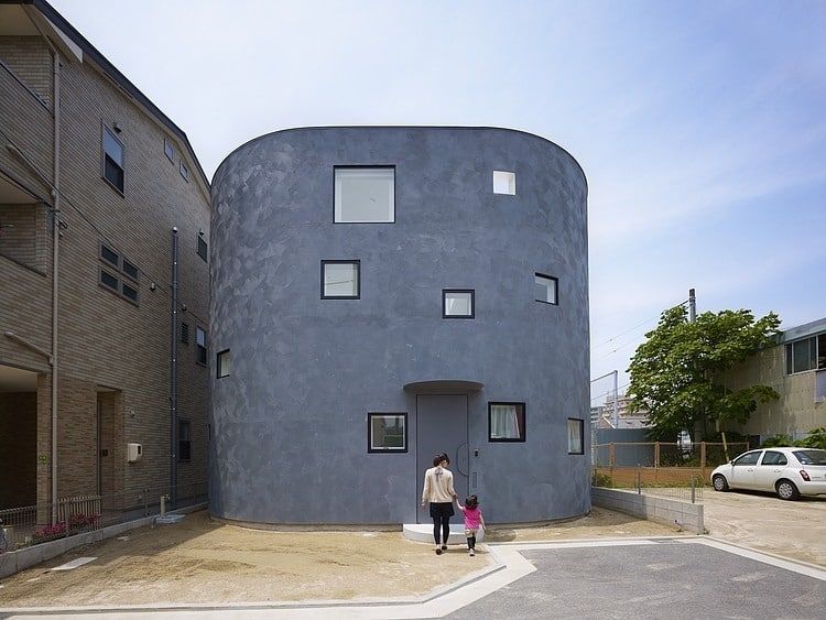 spacious oval plan hiroshima home uses light creatively 1 front