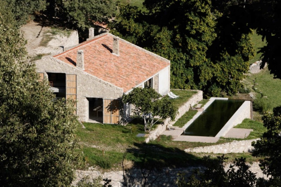 spanish stable turned contemporary stone home 18