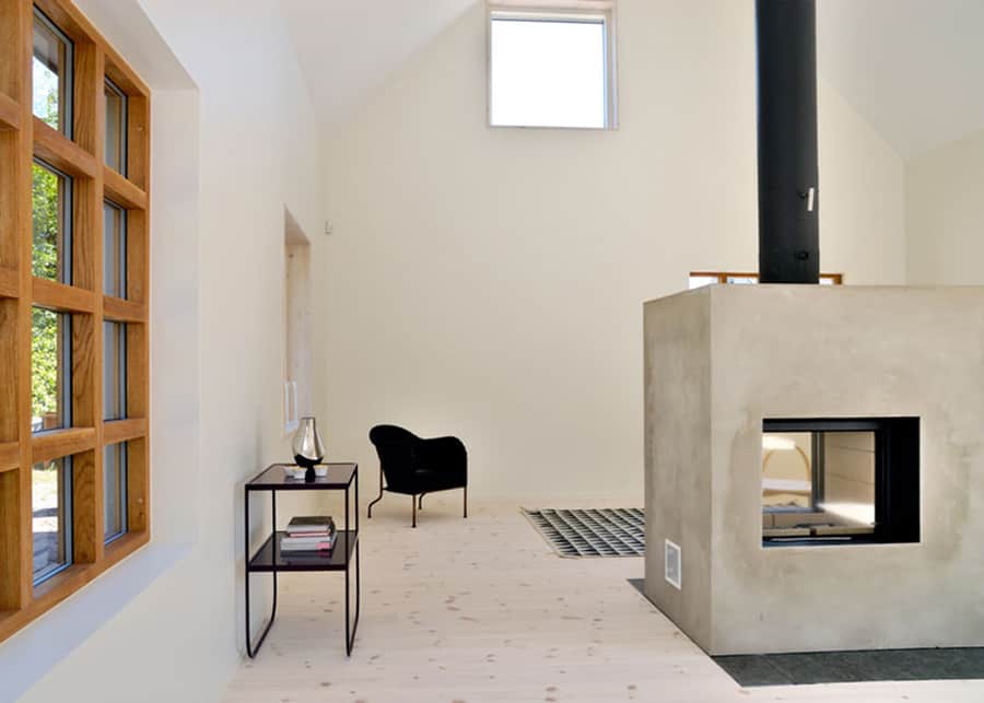 swedish loft house with concrete fireplace feature 3