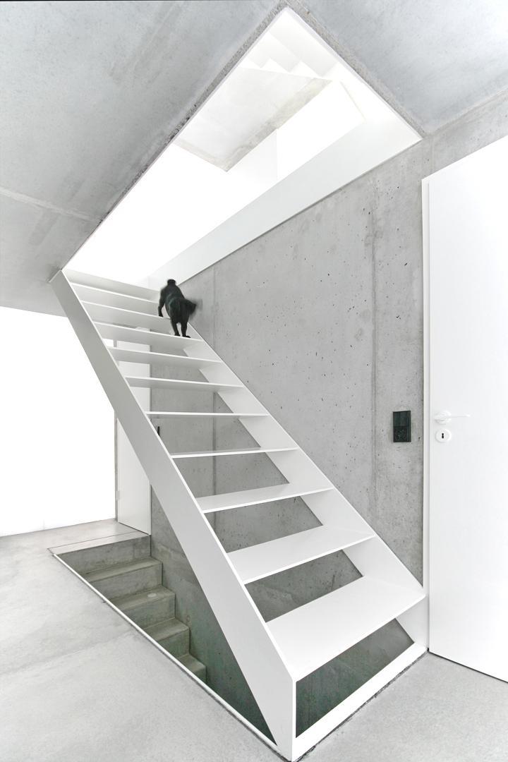tall minimalistic hillside house built from concrete 13 top stairs