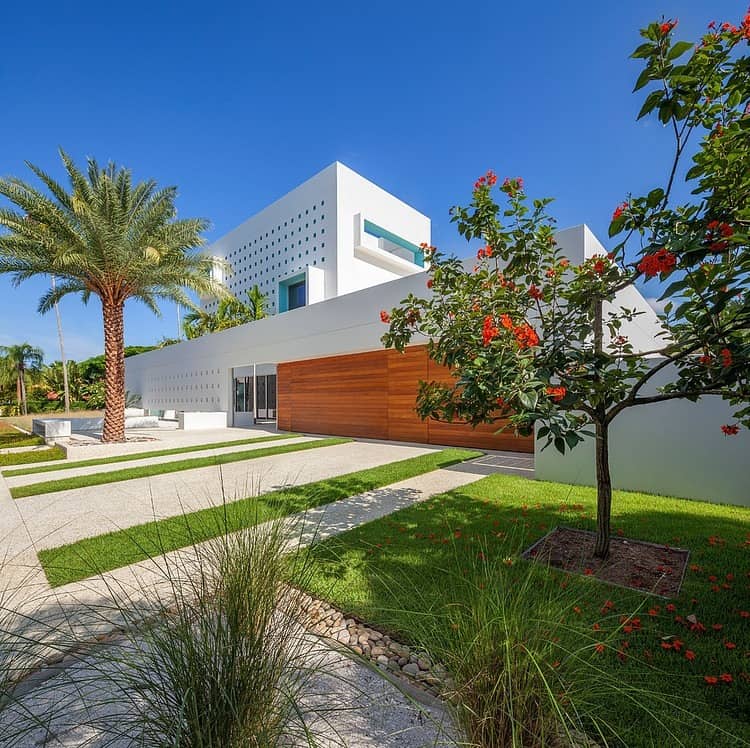 tall private florida home with open indoor outdoor hallways 5 right front corner