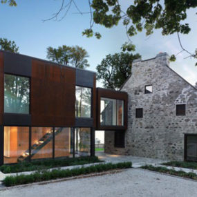 Traditional stone farmhouse extended with glass and steel addition