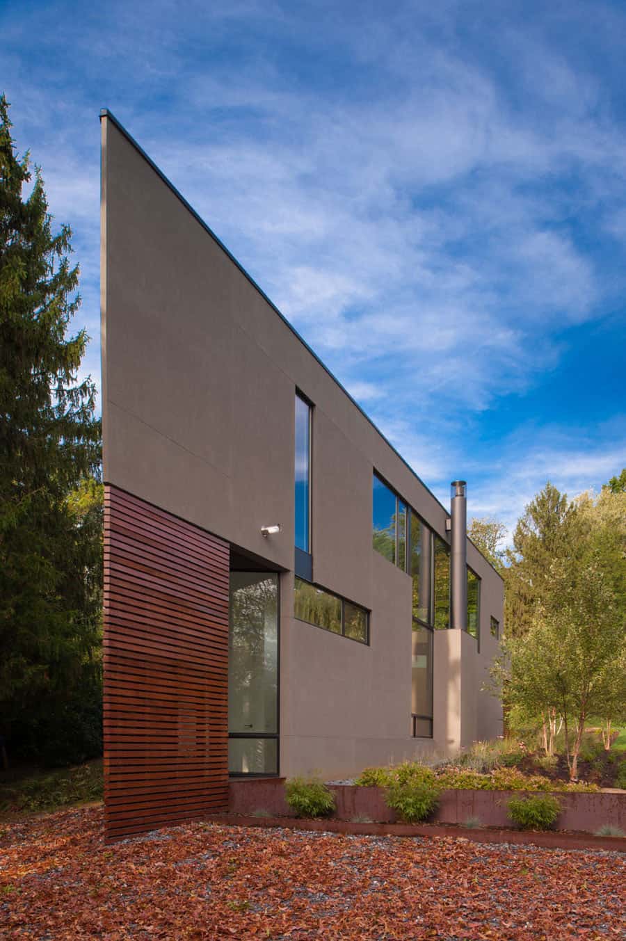 triangular house with bridge to office loft overhead 1