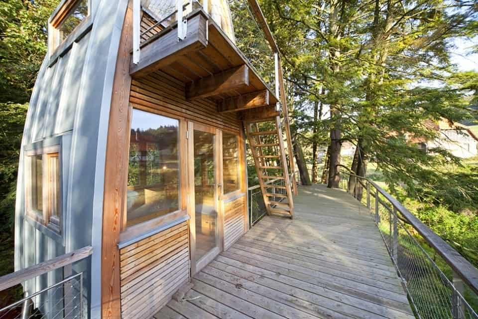 unusual-forest-cabin-on-stilts-over-pond-6-front-entrance.jpg