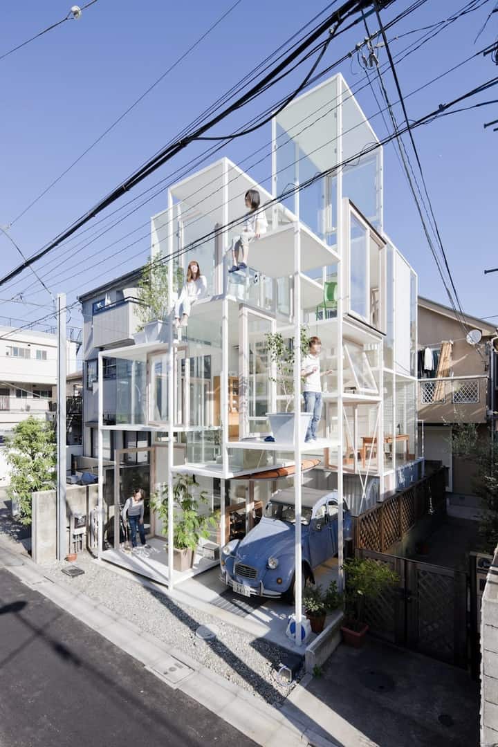 Urban Glass-Walled House With Platform Living Spaces