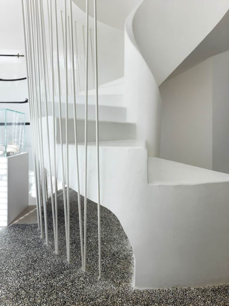 white-shades-define-luxurious-multistory-milan-apartment-5-stairs-bottom-close.jpg