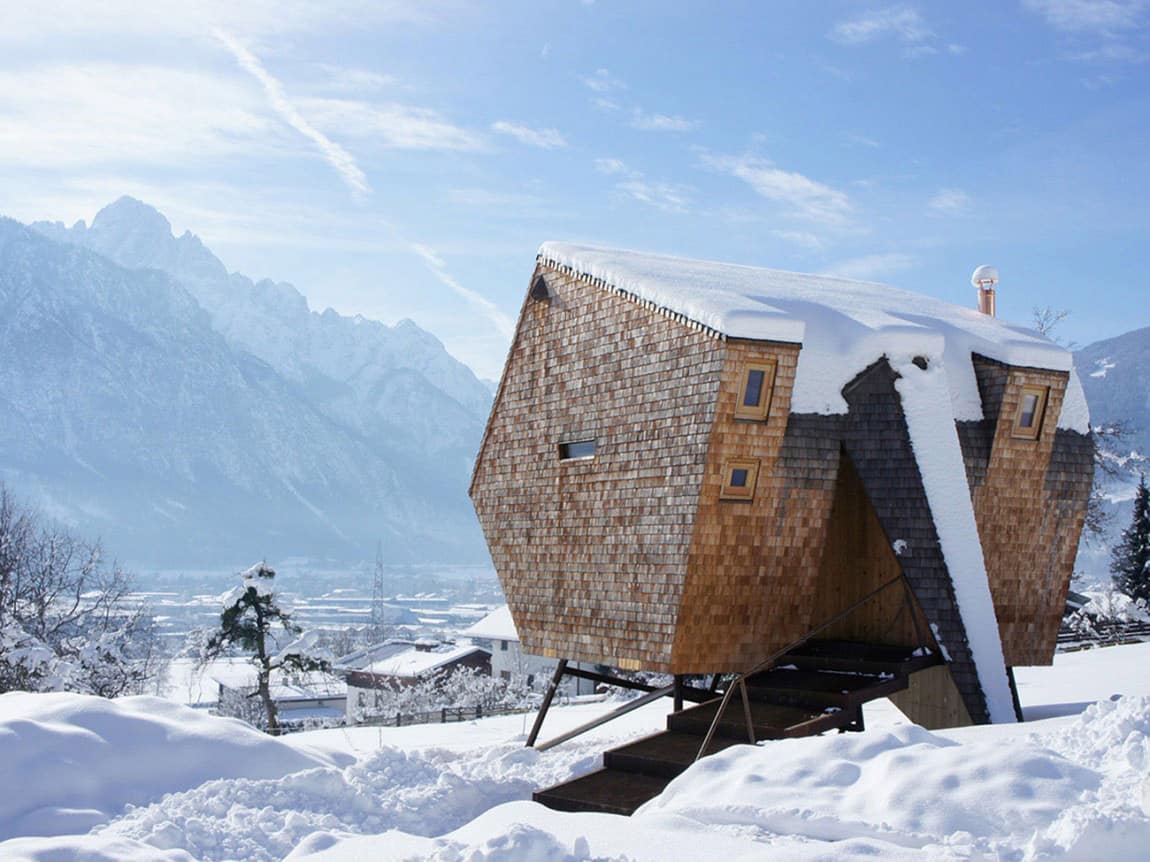 Wood Shingled Austrian Mountain House with Sloped Walls