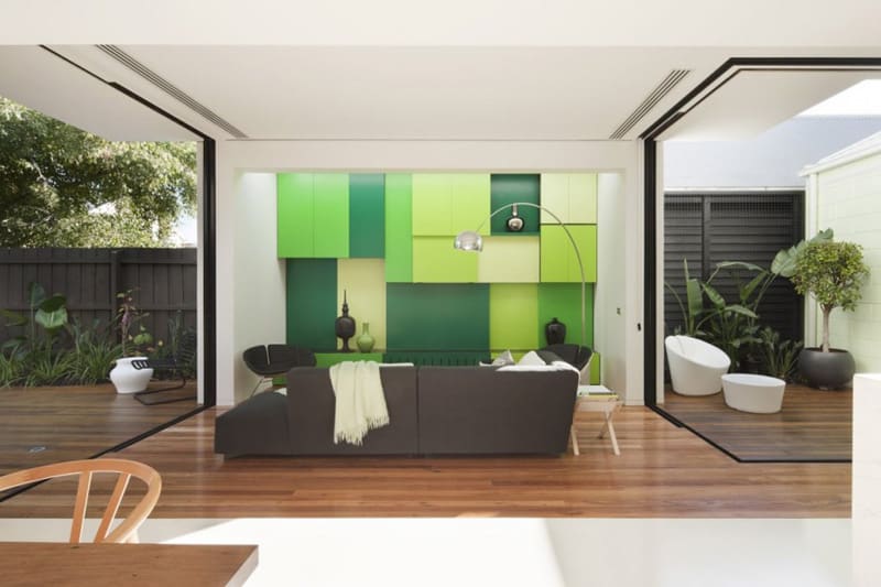 green entry door sets the green motif for the entire house 3