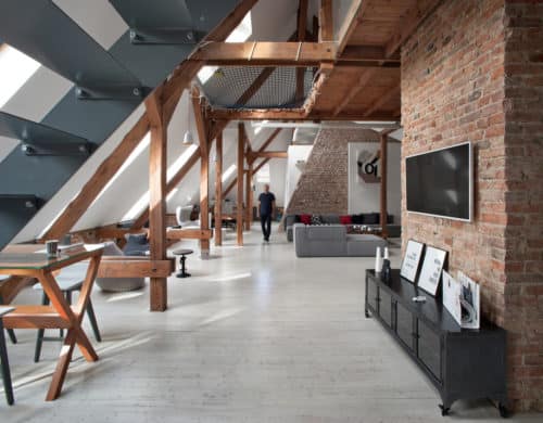 Office Attic Converted Into Loft Apartment Keeping Original Wood and Brick