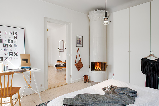 casually-comfortable-decor-driven-apartment-sweden-fireplace.jpg
