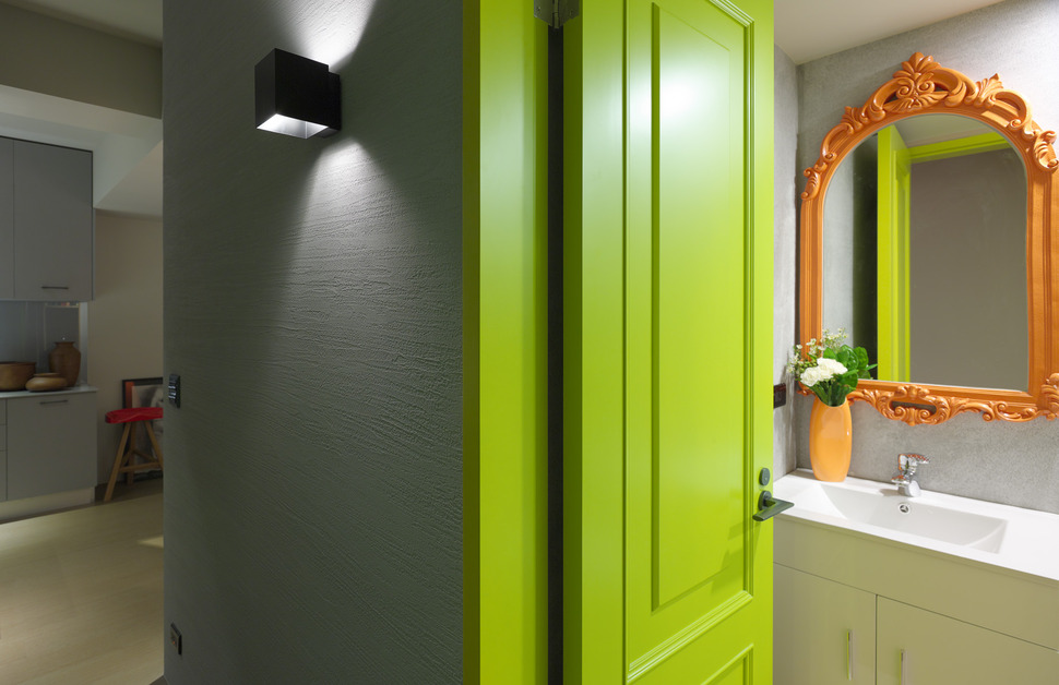 ganna-design-modernizes-a-small-taiwanese-apartment-orange-powder-room-mirror.jpg