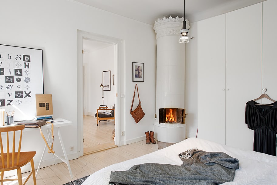 casually comfortable decor driven apartment sweden fireplace