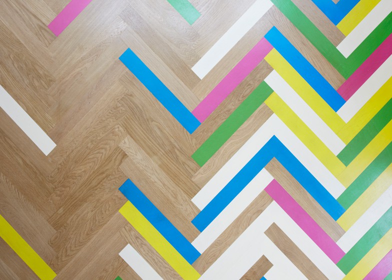 colorful graphic interiors featuring bright herringbone floors 2