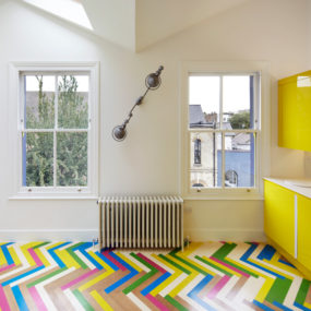 Bright Herringbone Floors Create Colorful Graphic Interiors
