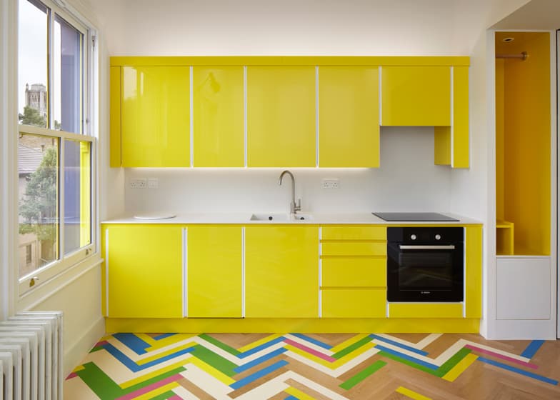colorful-graphic-interiors-featuring-bright-herringbone-floors-3.jpg