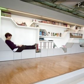 Industrial Loft With Seating Integrated Into Shelves