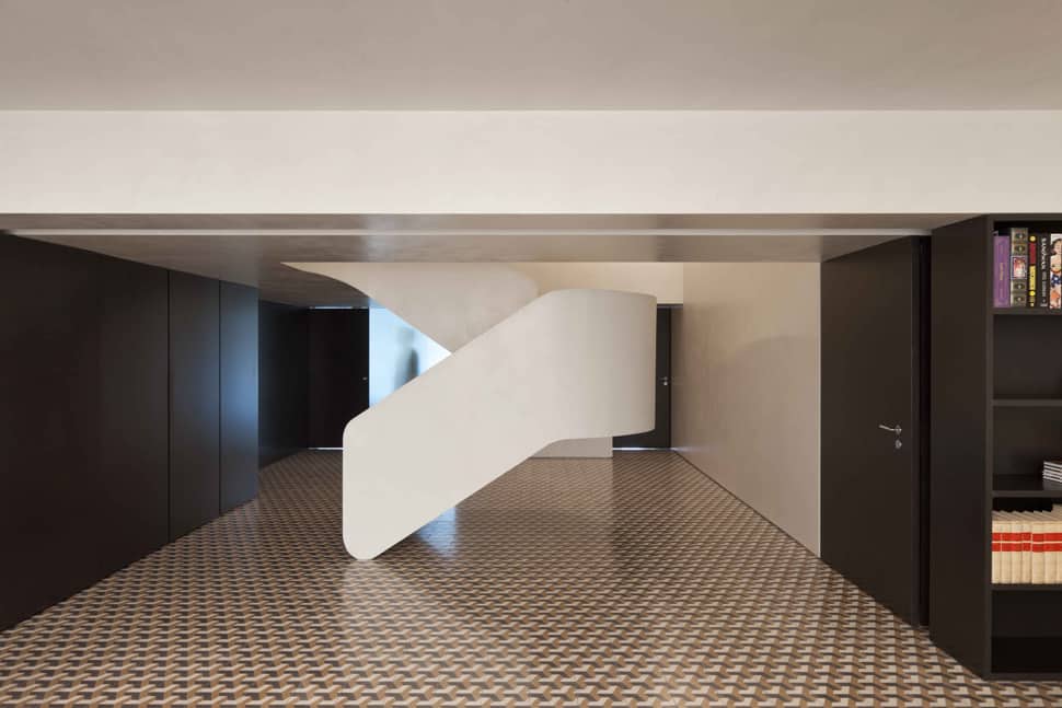 minimalist home with bold flooring and staircase sculpture 2