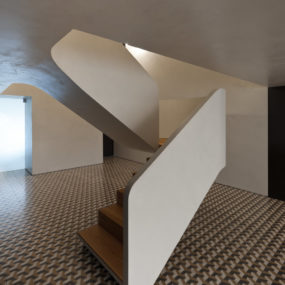 Minimalist Home Wows with Bold Flooring and Staircase Sculpture