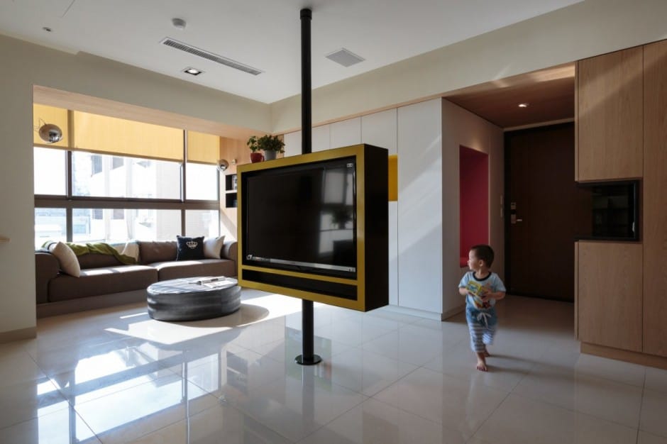 pivoting tv turns playful apartment into entertainment area 3