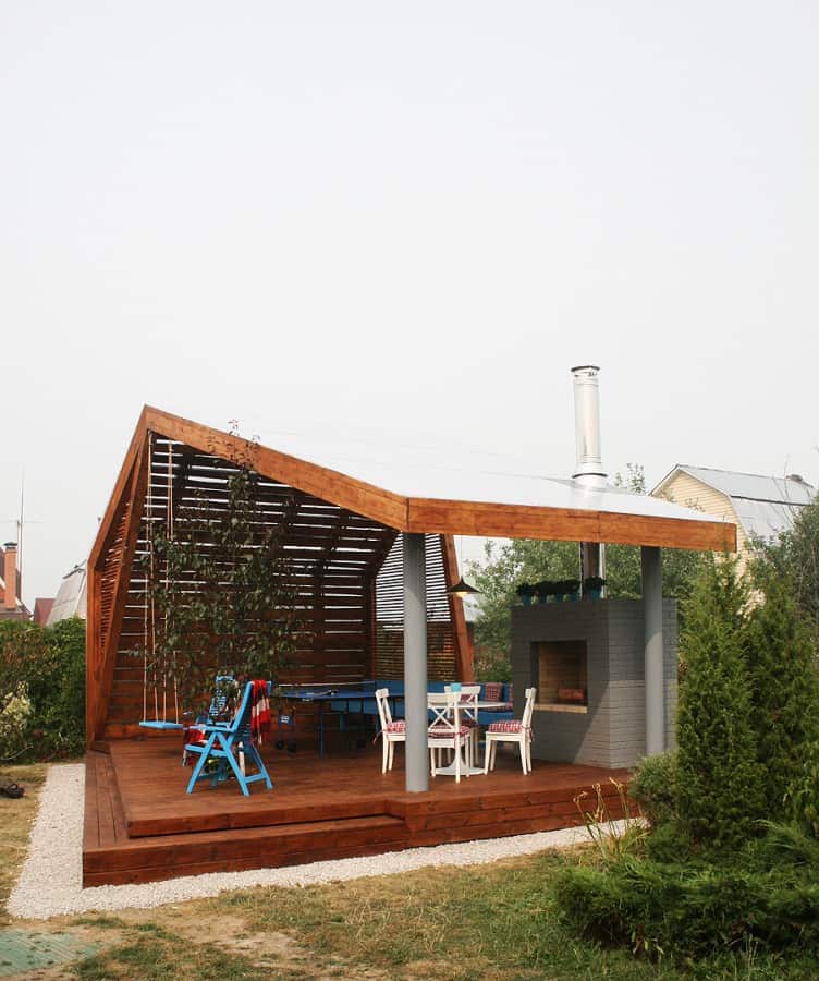 modern outdoor pavilion with fireplace and ping pong table 5