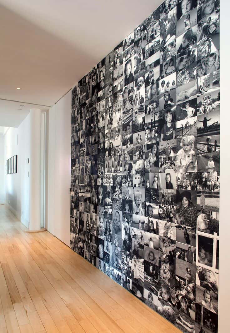 wall decorated in black and white photos floor to ceiling