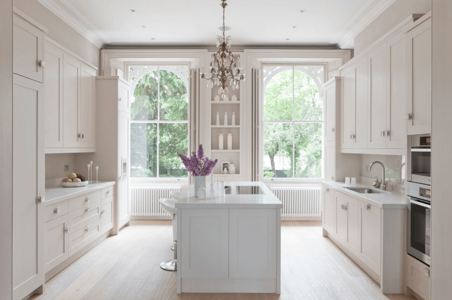 white kitchen with large windows 900x598 37 Bright, White Kitchens To Emulate Your Own After